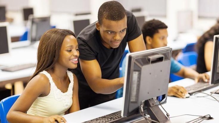 Young Nigerian building digital skills and professional connections symbolising growth in capability network and reputation